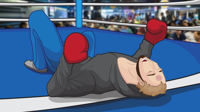 Player dressed as a boxer knocked out in the ring